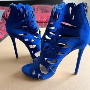 Blue open toed heeled booties.